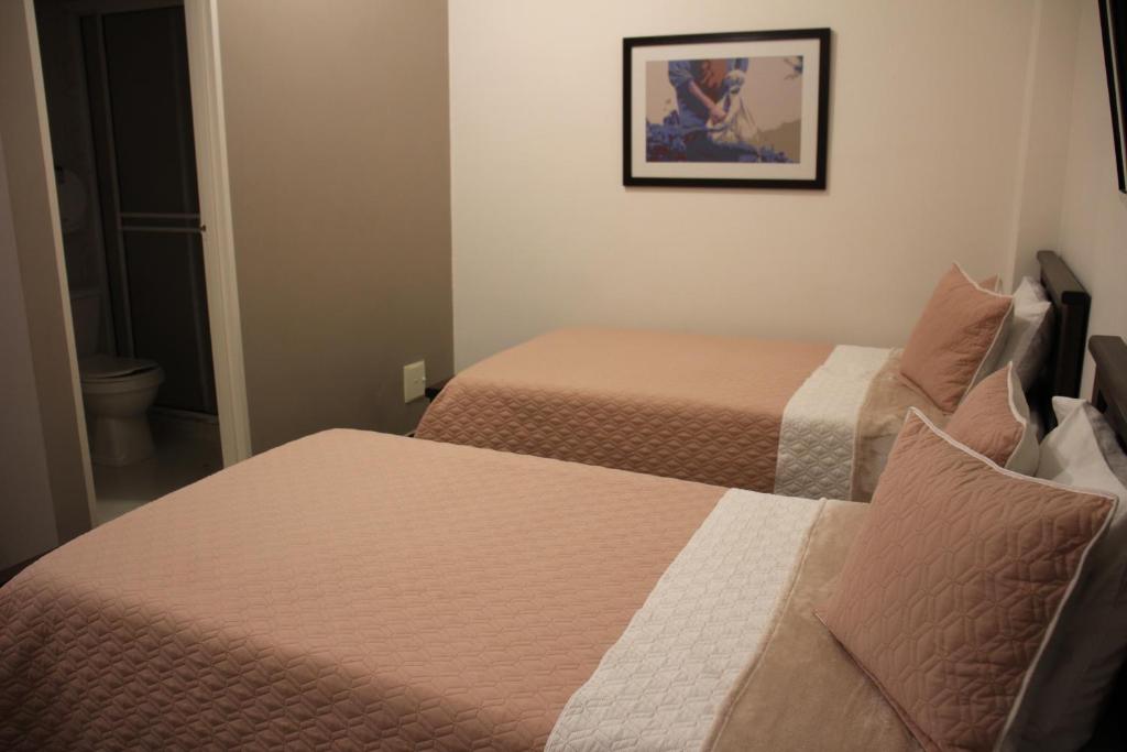 Postel nebo postele na pokoji v ubytování Hotel Plaza El Santuario