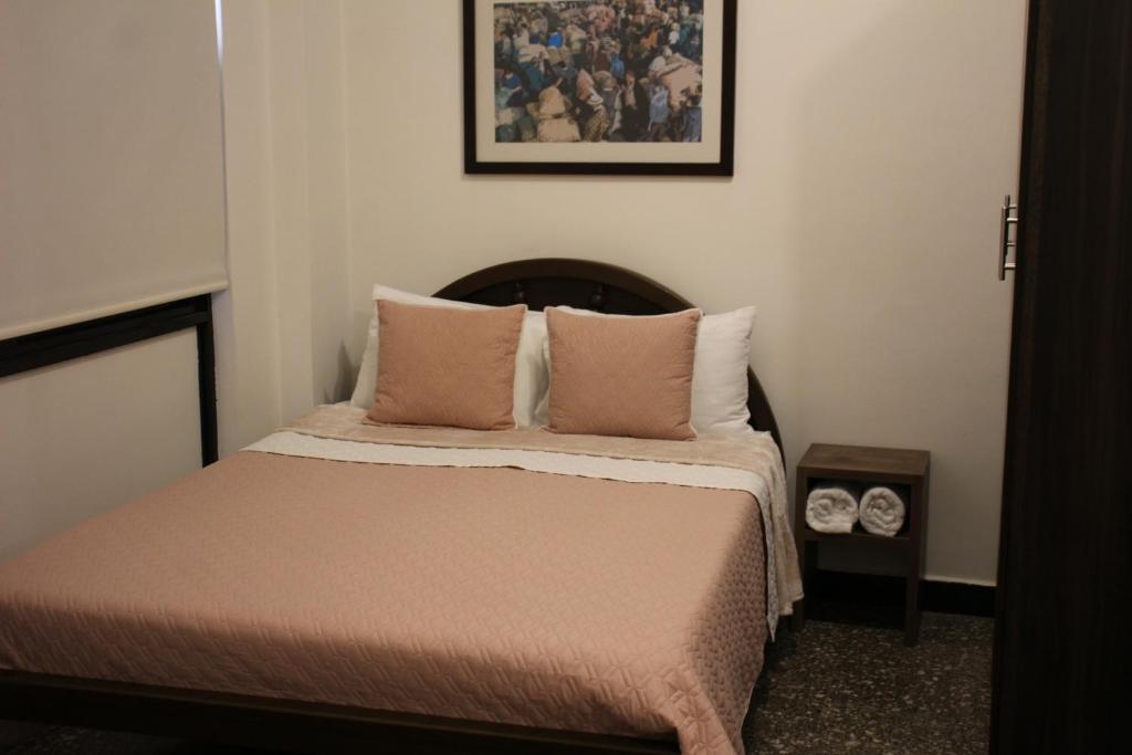 Postel nebo postele na pokoji v ubytování Hotel Plaza El Santuario