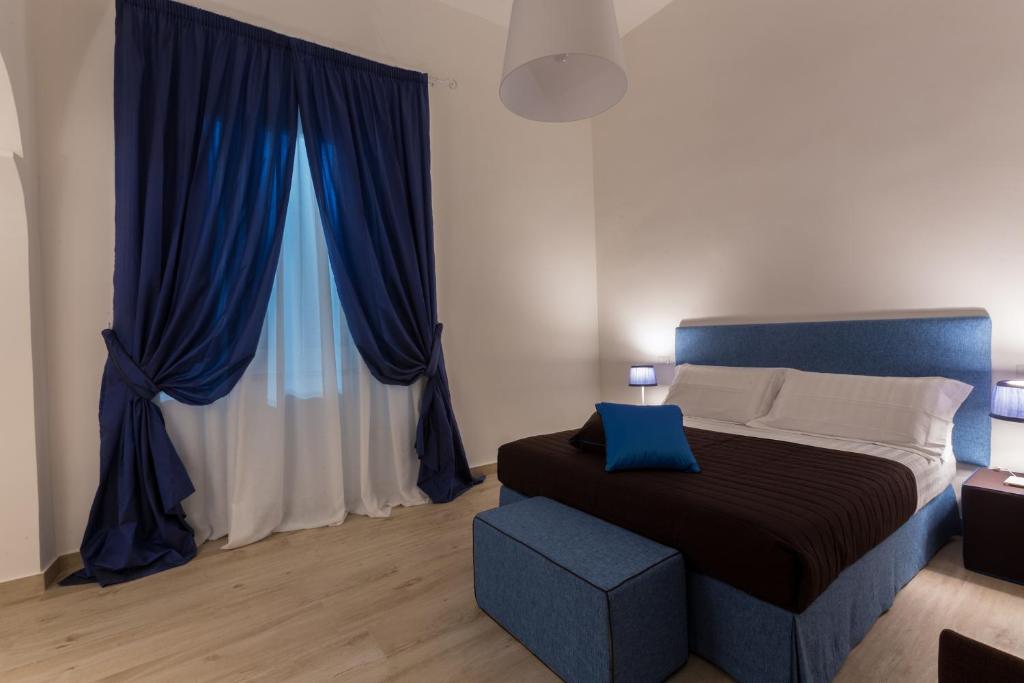 Postel nebo postele na pokoji v ubytování B&B Sigò