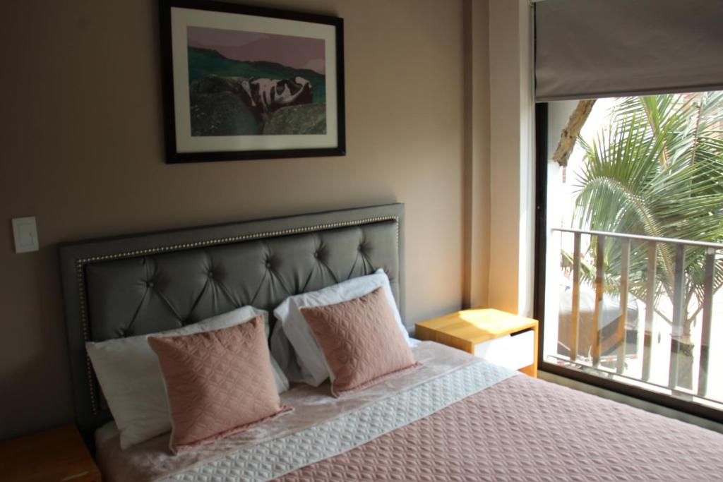 Postel nebo postele na pokoji v ubytování Hotel Plaza El Santuario