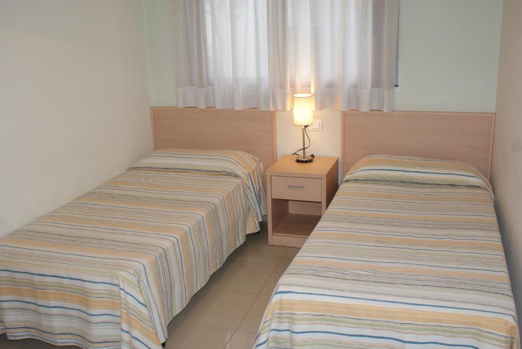 Posteľ alebo postele v izbe v ubytovaní Mestral - apartamentos céntricos