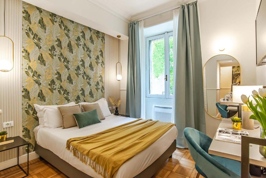 a hotel room with a bed and a mirror at 94Rooms Vatican Guest House - Vigliena in Rome