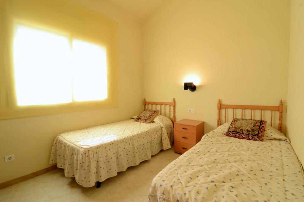 A bed or beds in a room at TARRACO 15 (BOLLERIA)
