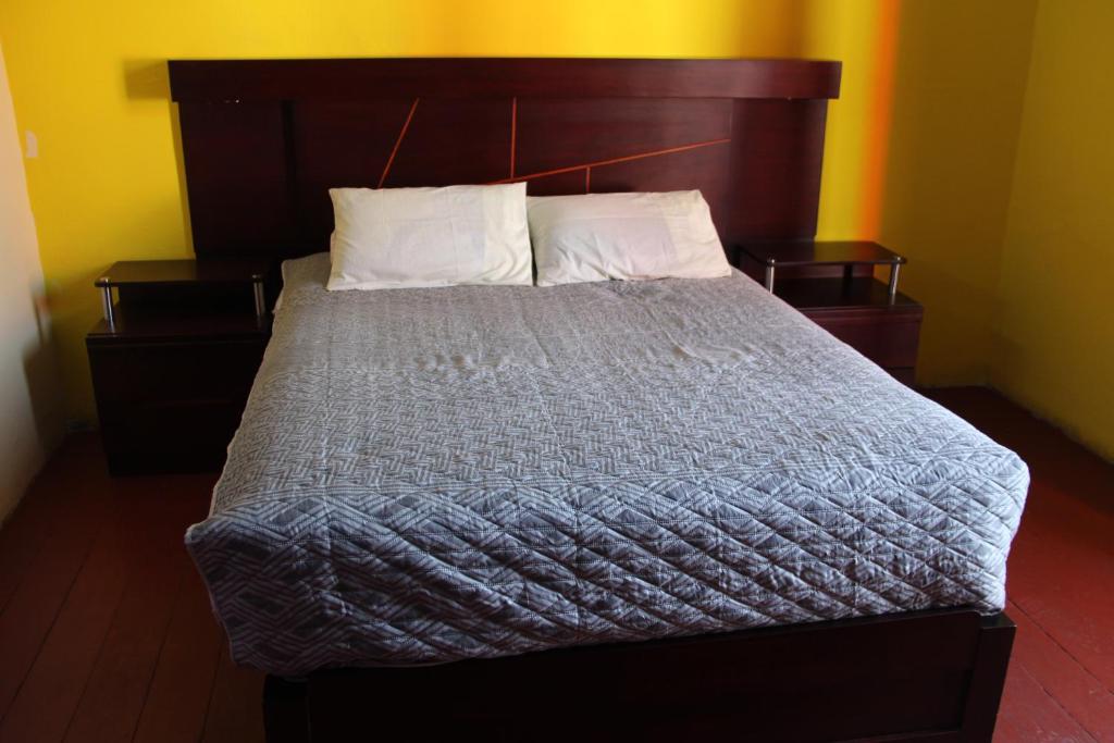 Postel nebo postele na pokoji v ubytování pusary hostel