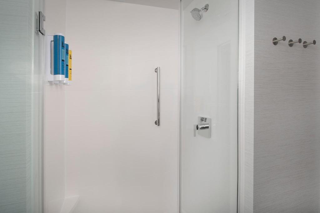 a white shower stall in a bathroom with a shower at Tru By Hilton Mt Pleasant Charleston in Charleston