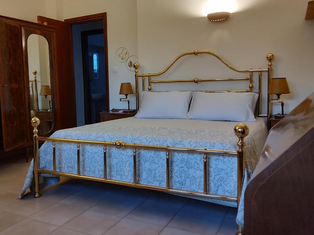 Łóżko lub łóżka w pokoju w obiekcie Villa Teresa