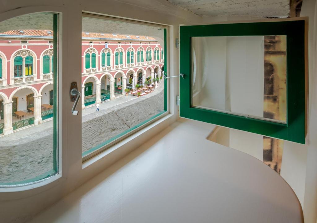 Postel nebo postele na pokoji v ubytování Procurator 7 Luxury Rooms