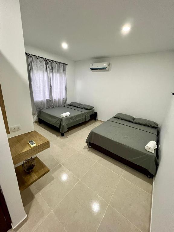 Postel nebo postele na pokoji v ubytování zara's apartamento en coveñas