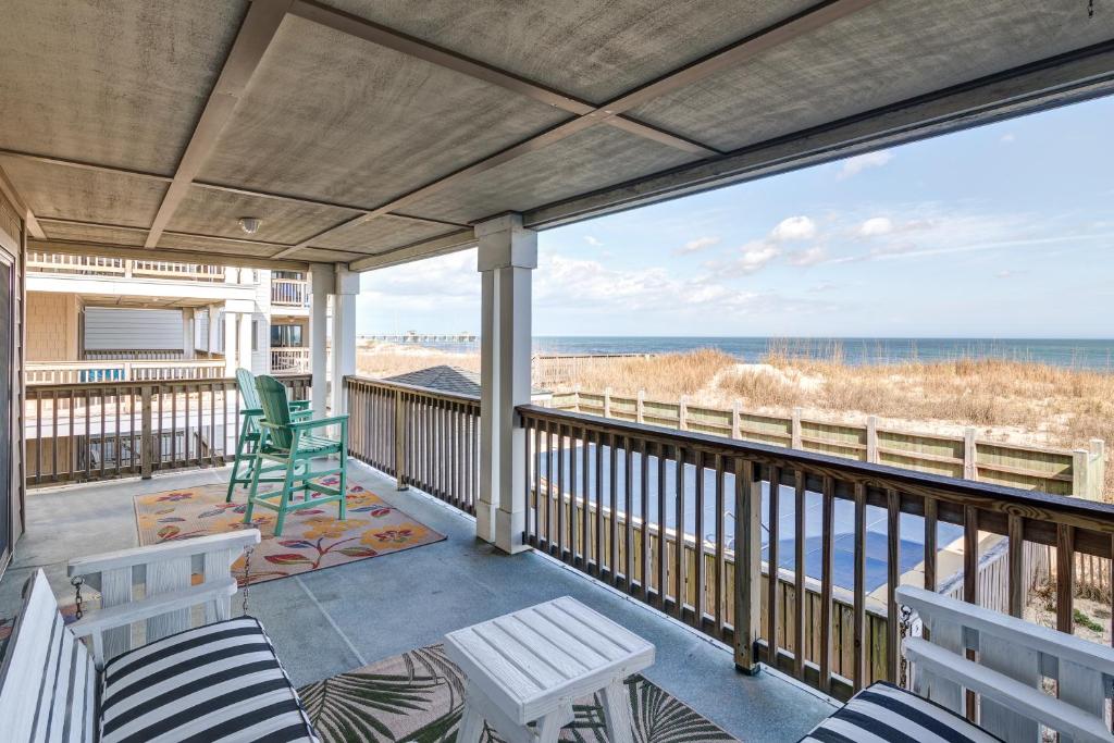 a balcony with chairs and a view of the ocean at 5737 - Diamond by the Sea by Resort Realty in Nags Head