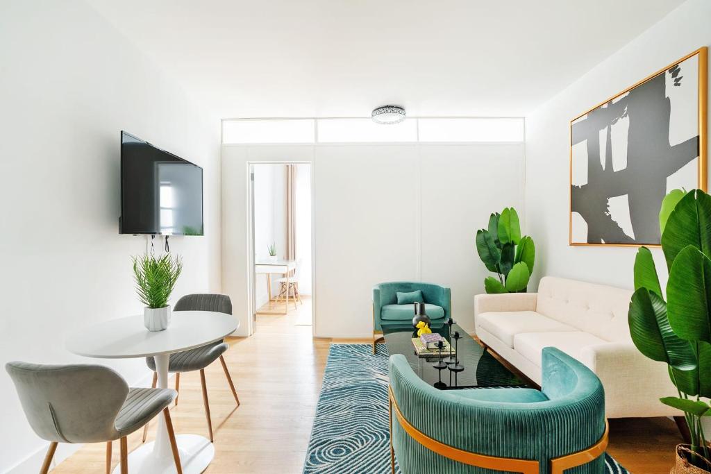 a living room with a couch and chairs and a table at 444-3A Newly renovated 1BR - Elevator Building in New York