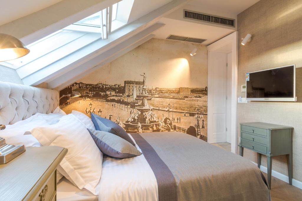 Postel nebo postele na pokoji v ubytování Procurator 7 Luxury Rooms