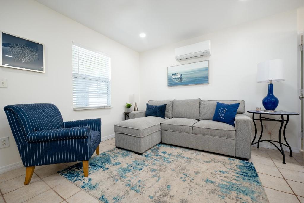 a living room with a couch and a chair at NEW Listing! 5 Blocks to the Beach! in Jacksonville Beach