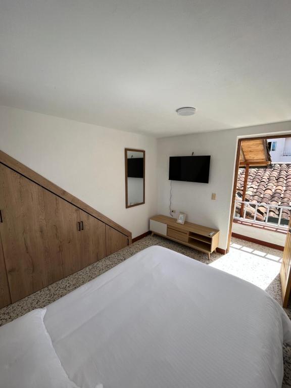Postel nebo postele na pokoji v ubytování Casa Blanca Hostal