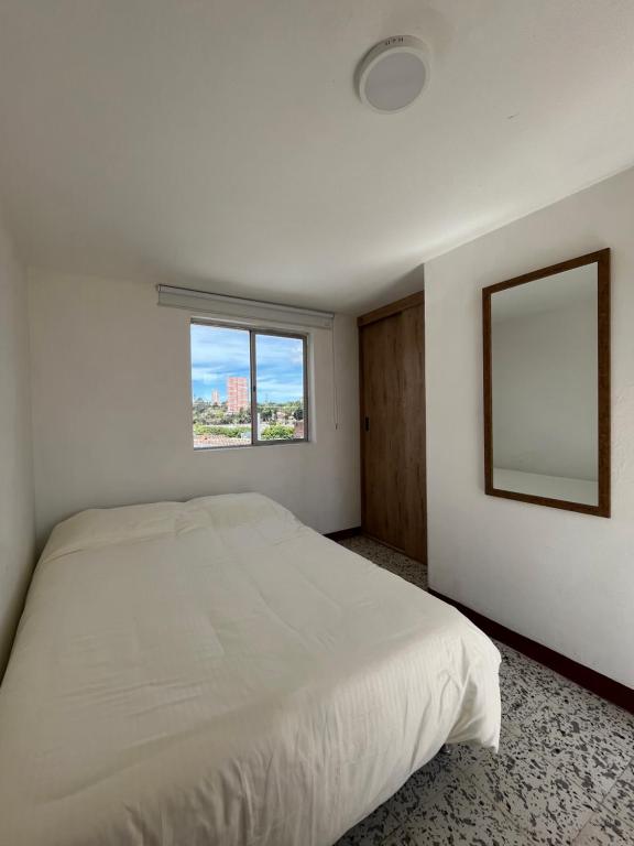 Postel nebo postele na pokoji v ubytování Casa Blanca Hostal