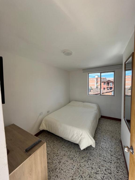 Postel nebo postele na pokoji v ubytování Casa Blanca Hostal