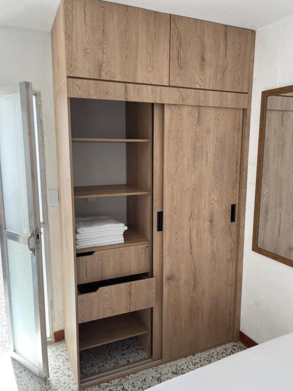 Postel nebo postele na pokoji v ubytování Casa Blanca Hostal