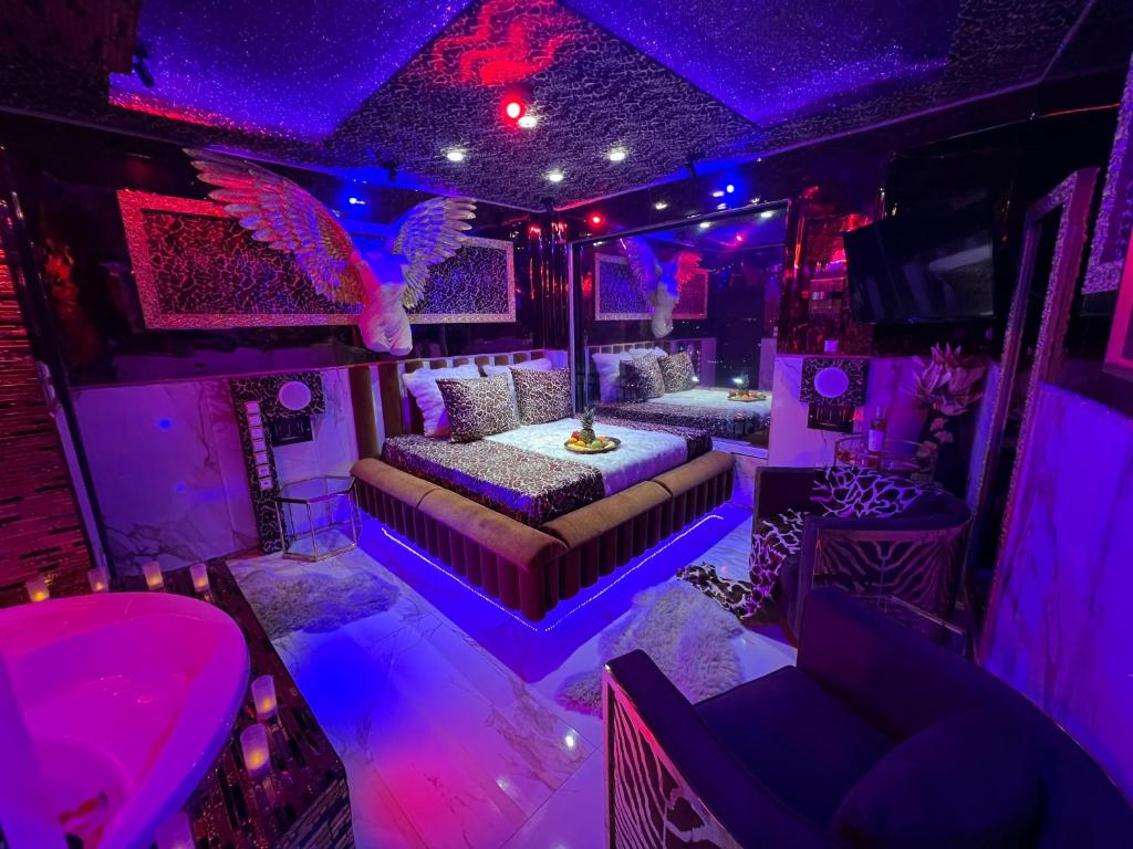 a party bus with two beds and an eagle on the ceiling at Priamos Hotel Erato in Athens