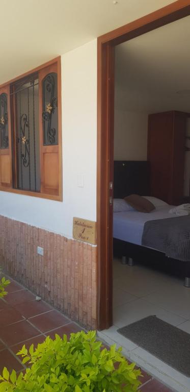 Postel nebo postele na pokoji v ubytování Hotel Resort Campestre Puerta Del Sol - San Gil