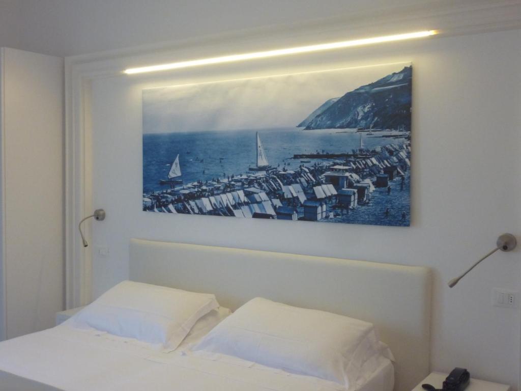 Postel nebo postele na pokoji v ubytování Hotel Nobel