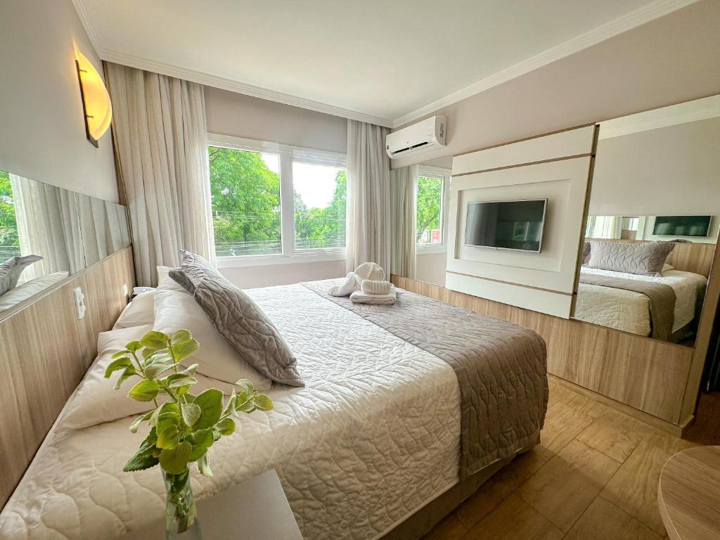 Postel nebo postele na pokoji v ubytování Nadai Confort Hotel e Spa