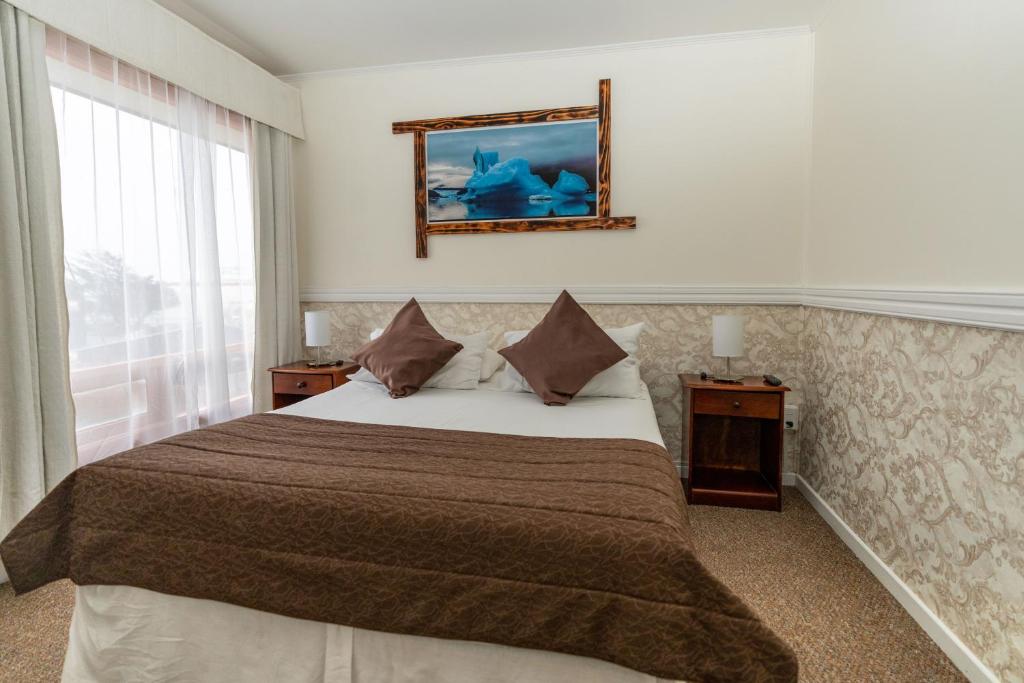 Postel nebo postele na pokoji v ubytování Darwin Hotel