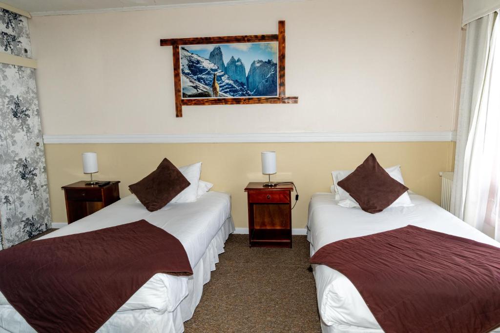 Postel nebo postele na pokoji v ubytování Darwin Hotel