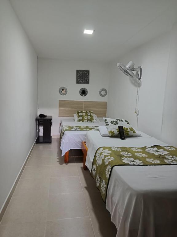 Postel nebo postele na pokoji v ubytování Hotel Mirador Plaza