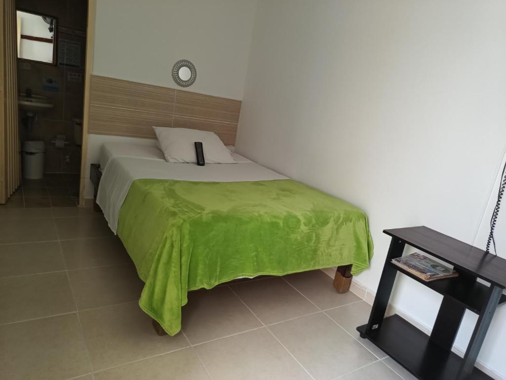 Postel nebo postele na pokoji v ubytování Hotel Mirador Plaza