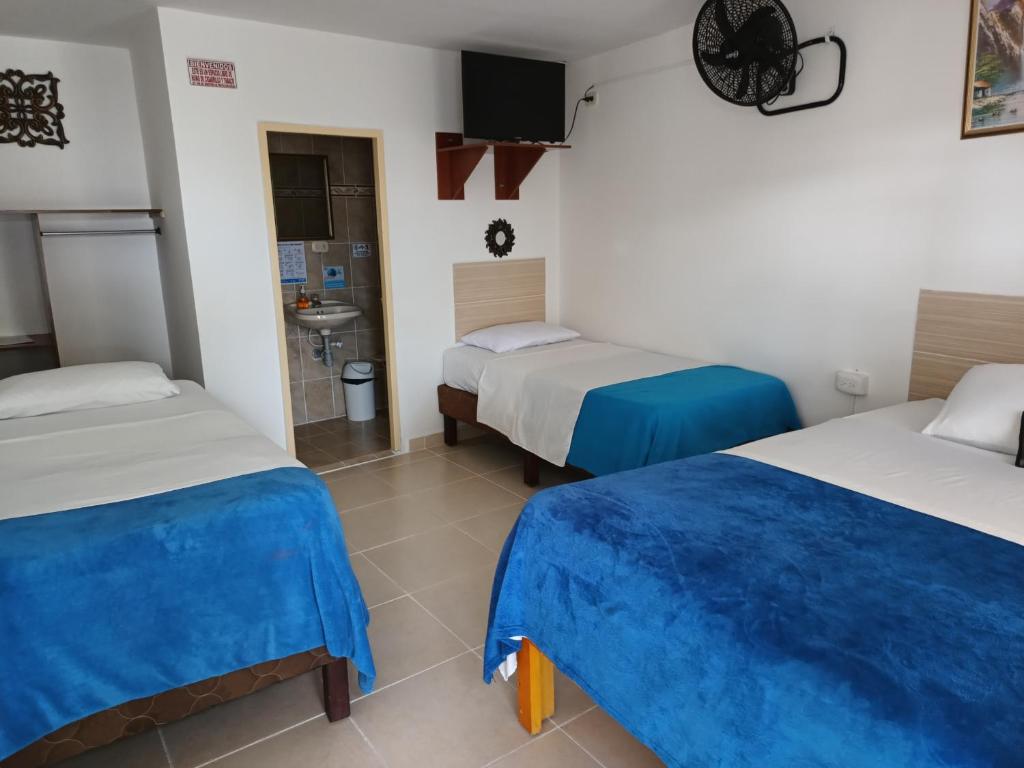 Postel nebo postele na pokoji v ubytování Hotel Mirador Plaza