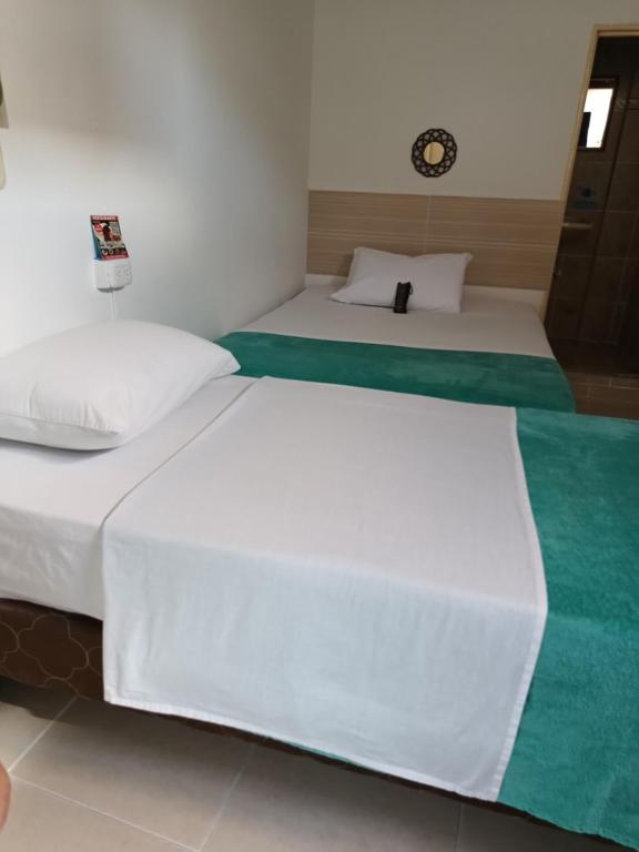 Postel nebo postele na pokoji v ubytování Hotel Mirador Plaza