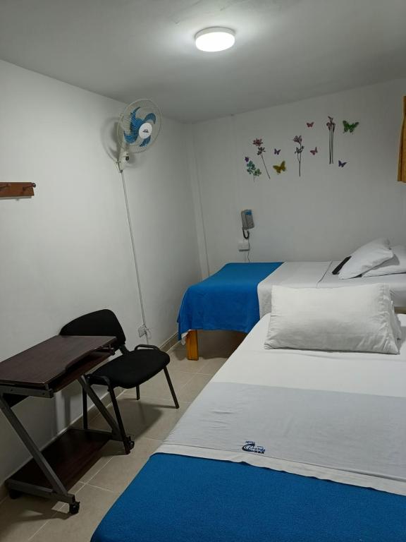 Postel nebo postele na pokoji v ubytování Hotel Mirador Plaza
