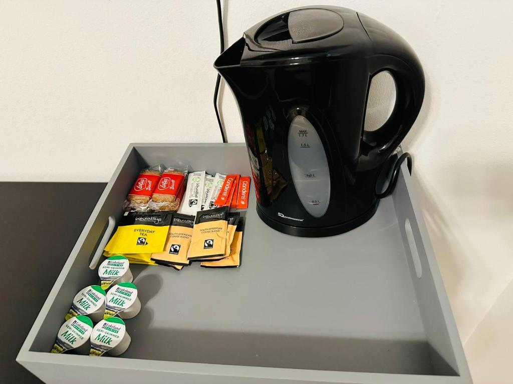 a black tea kettle sitting on top of a table at Premium Studio Flat 08 in Central London in London