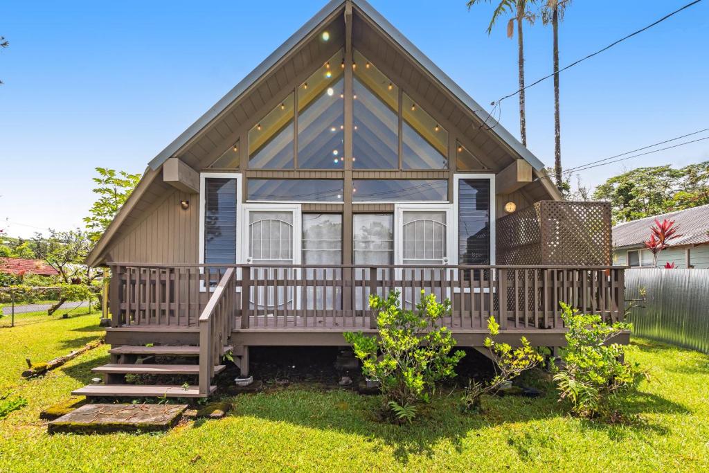 a tiny house with a porch and stairs at Sea Turtle Life in Pahoa