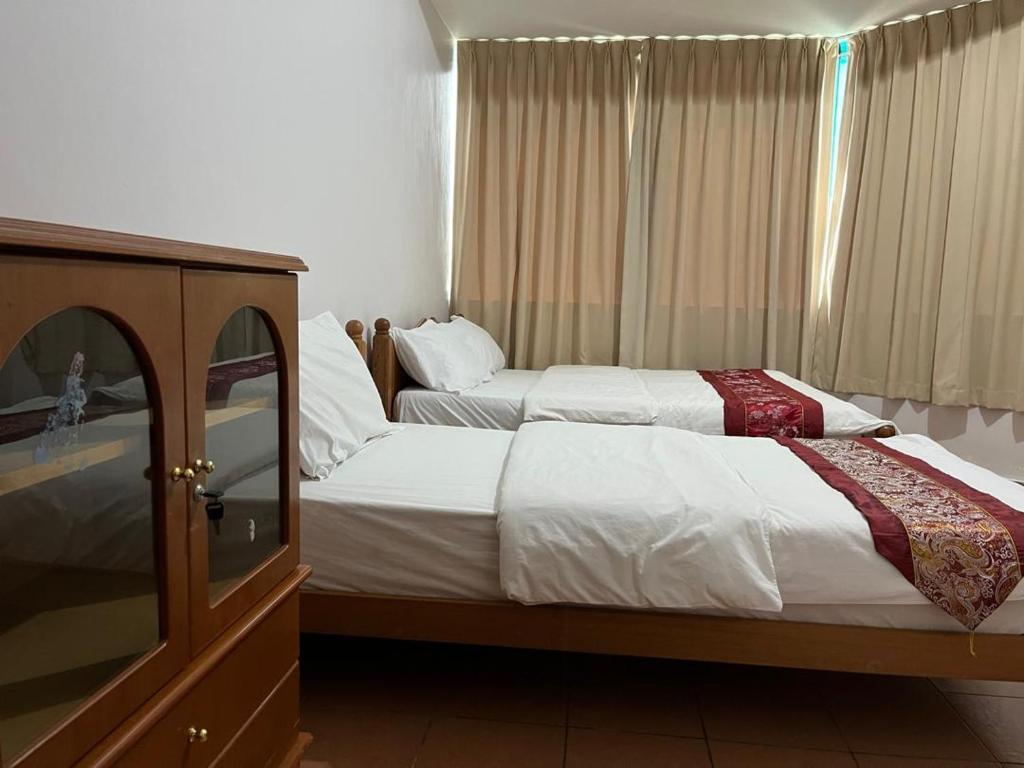 Miri City Centre Condo @ Imperial Mallにあるベッド