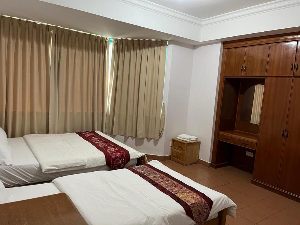 Miri City Centre Condo @ Imperial Mallにあるベッド