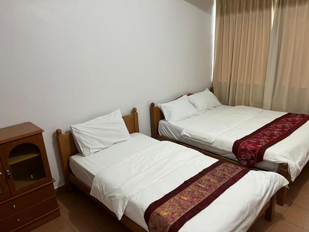 Miri City Centre Condo @ Imperial Mallにあるベッド