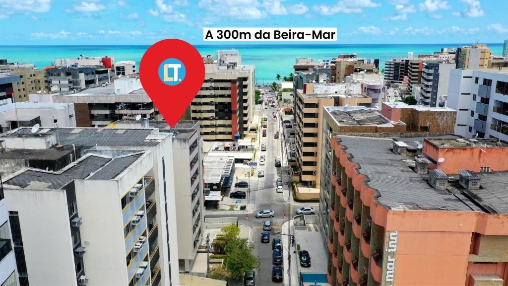 um mapa vermelho de uma cidade com edifícios em EDF SEVILHA - Apartamento com 1 suíte climatizada e 2 Banheiros, Sala Climatizada a 300 metros da Beira-Mar de Ponta Verde - EXCELENTE LOCALIZAÇÃO em Maceió