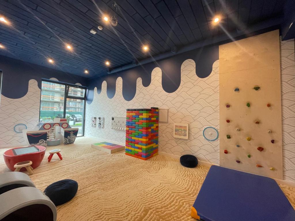 Ένα ή περισσότερα κρεβάτια σε δωμάτιο στο Golden Dunes Apartament Polanki Aqua