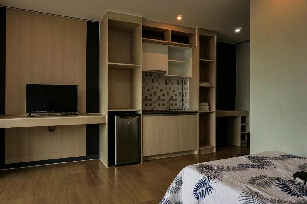 TV a/nebo společenská místnost v ubytování Emmaus condotel