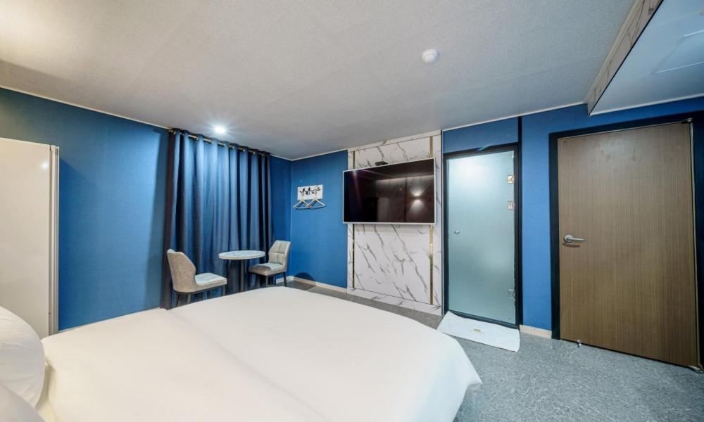 Postel nebo postele na pokoji v ubytování G7 Hotel