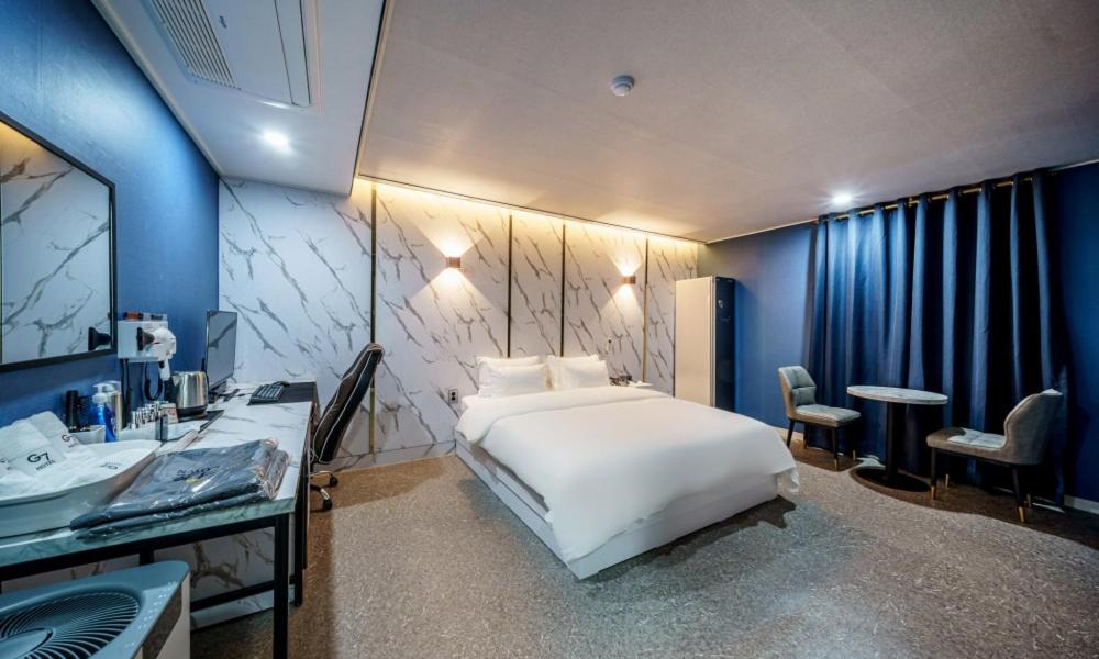 Postel nebo postele na pokoji v ubytování G7 Hotel