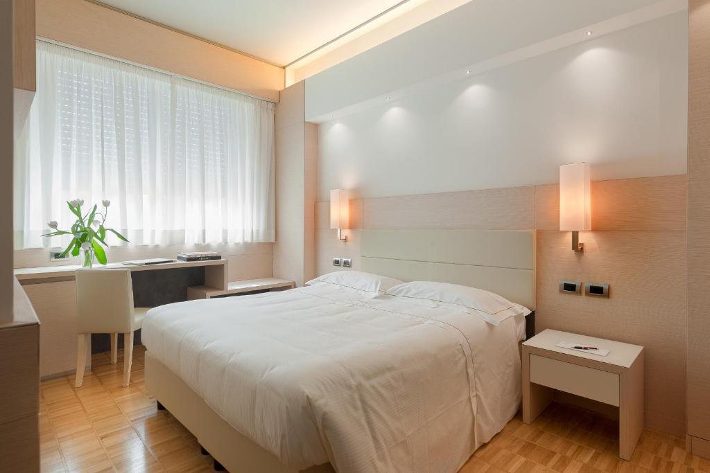Postel nebo postele na pokoji v ubytování Hotel Ariston