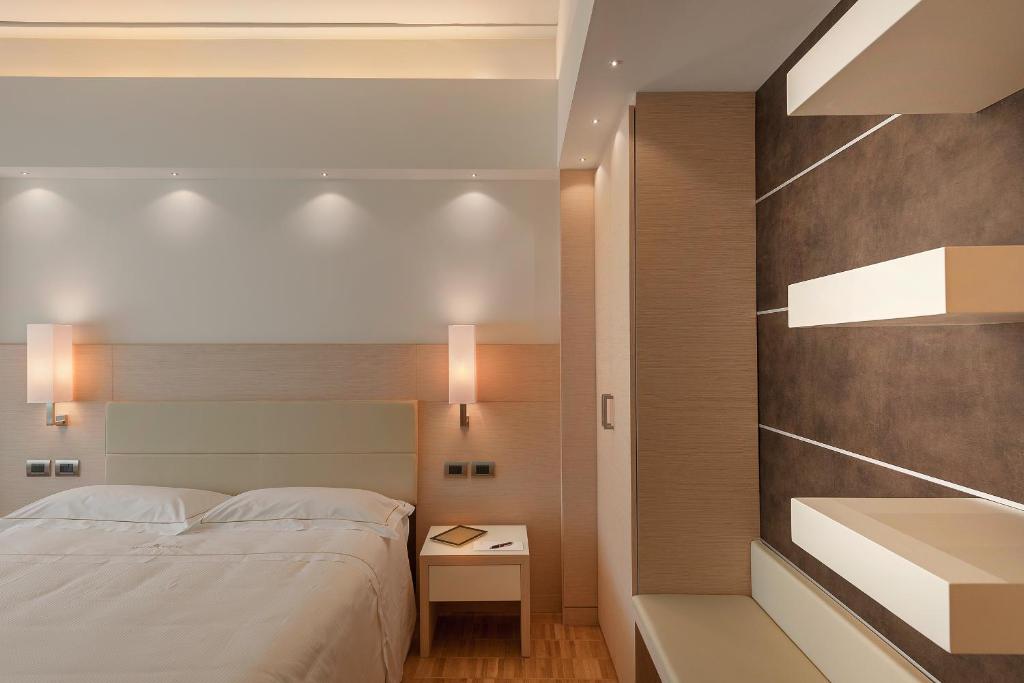 Postel nebo postele na pokoji v ubytování Hotel Ariston