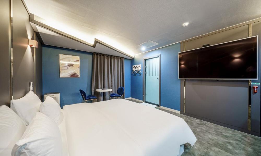 Postel nebo postele na pokoji v ubytování G7 Hotel
