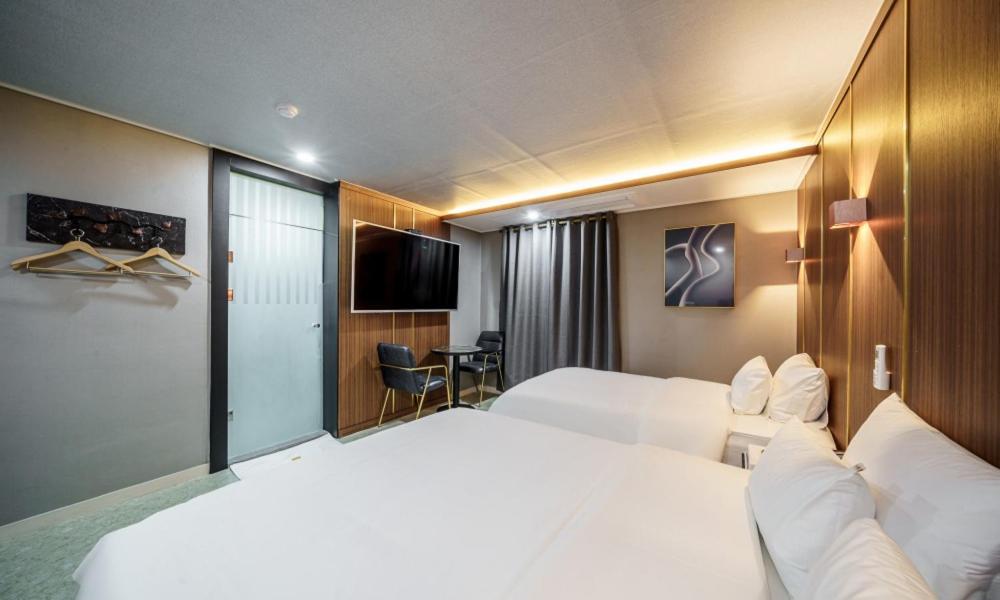 Postel nebo postele na pokoji v ubytování G7 Hotel