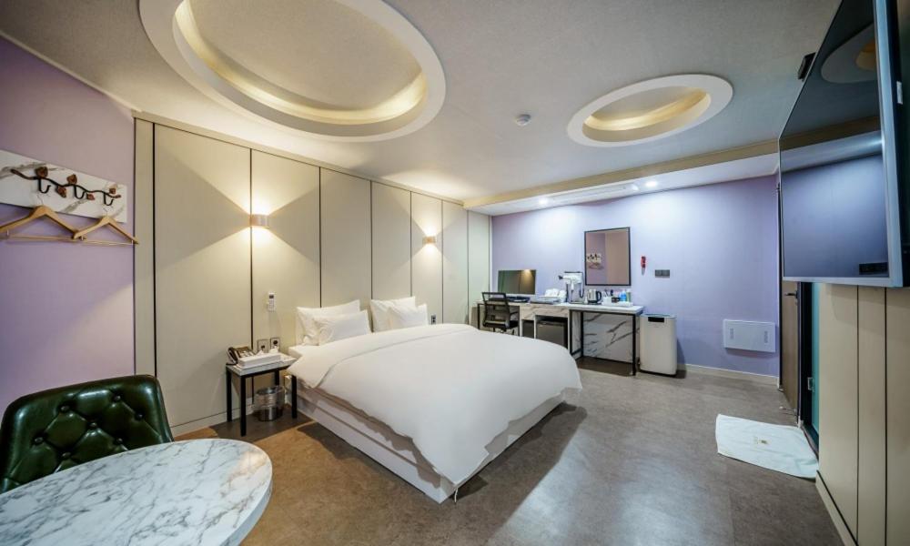 Postel nebo postele na pokoji v ubytování G7 Hotel