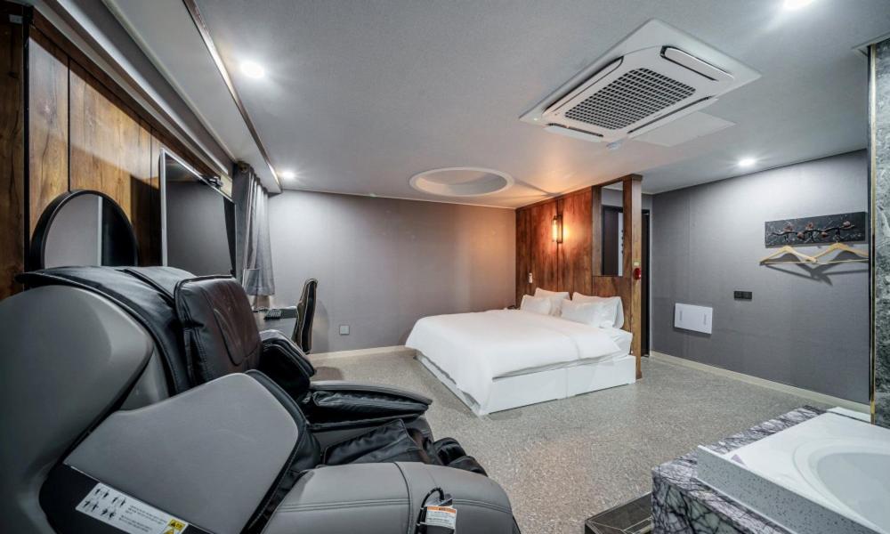 Postel nebo postele na pokoji v ubytování G7 Hotel