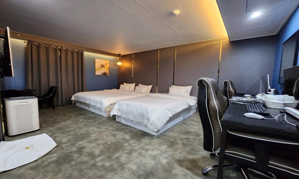 Postel nebo postele na pokoji v ubytování G7 Hotel