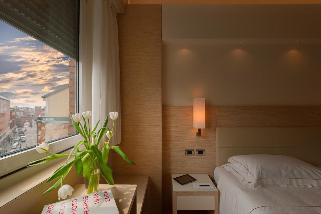 Postel nebo postele na pokoji v ubytování Hotel Ariston