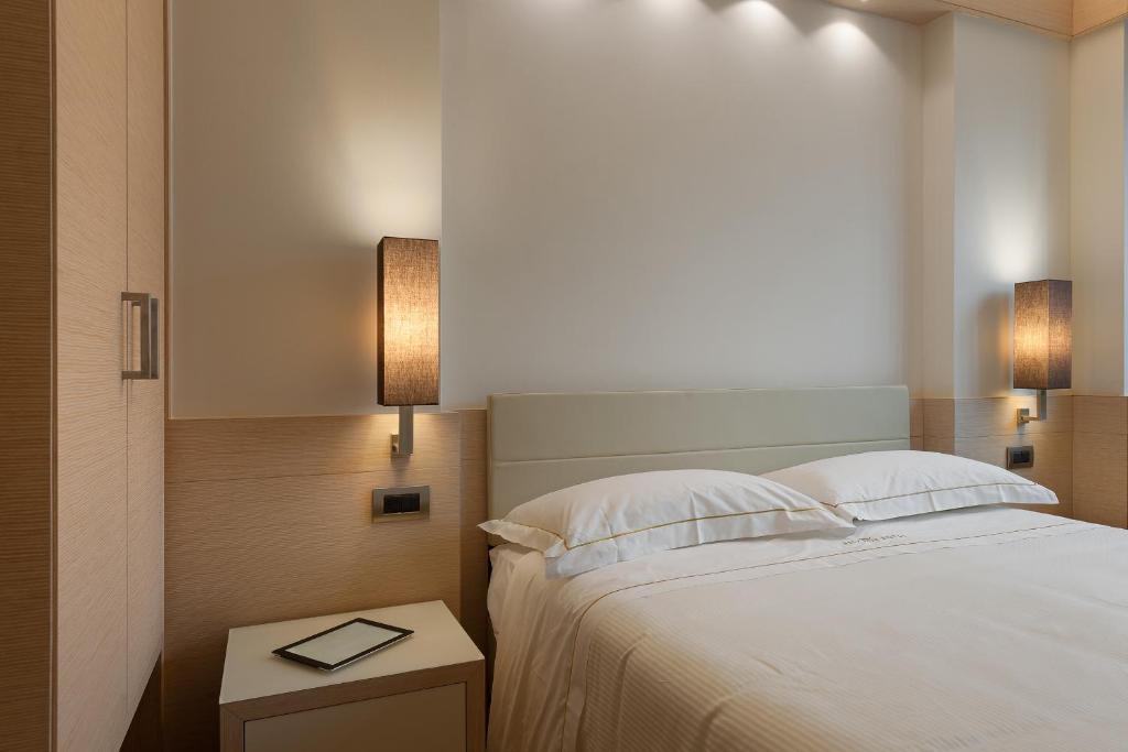 Postel nebo postele na pokoji v ubytování Hotel Ariston